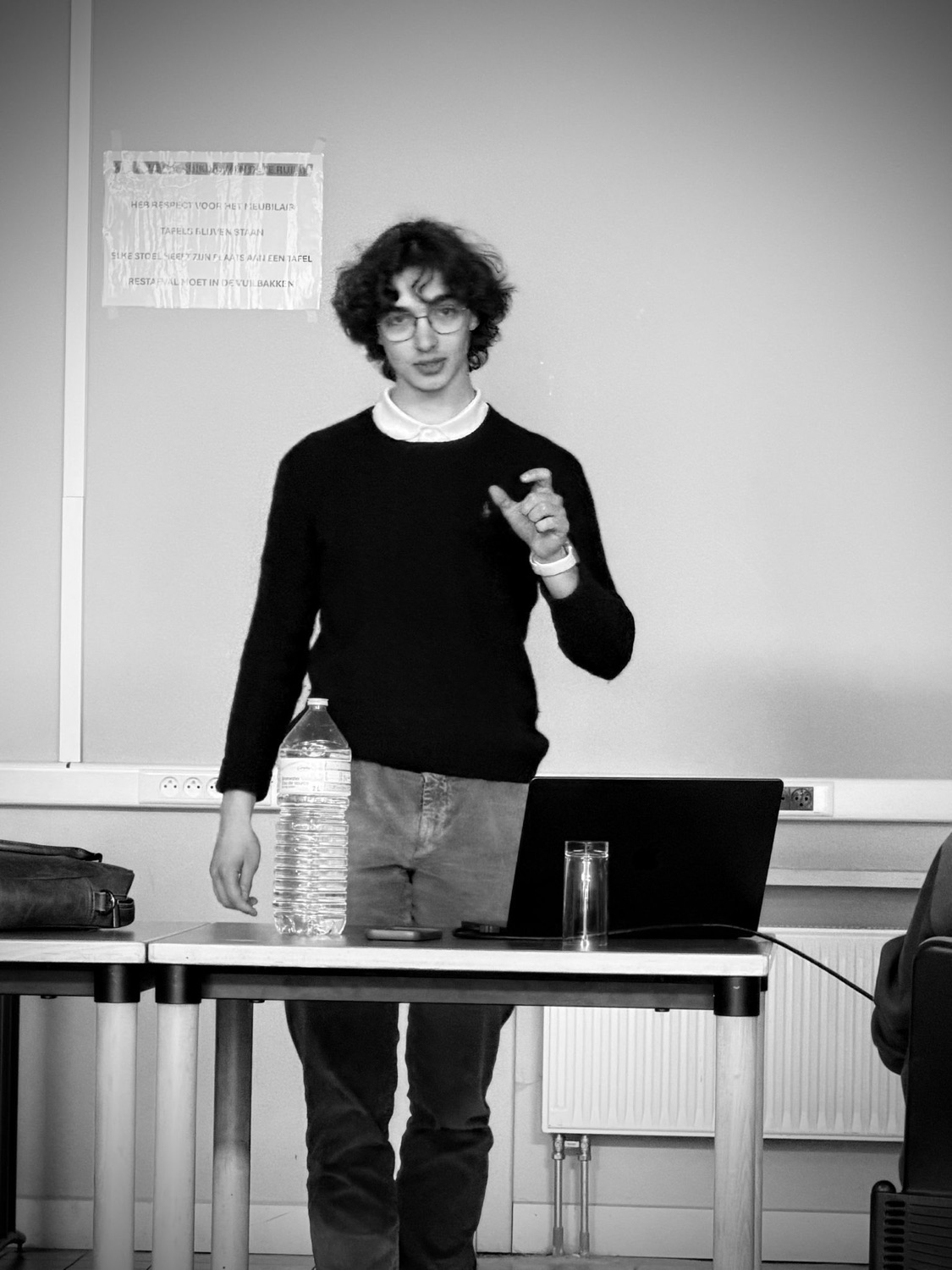 Jasper giving a talk to students, hands raised mid-sentence